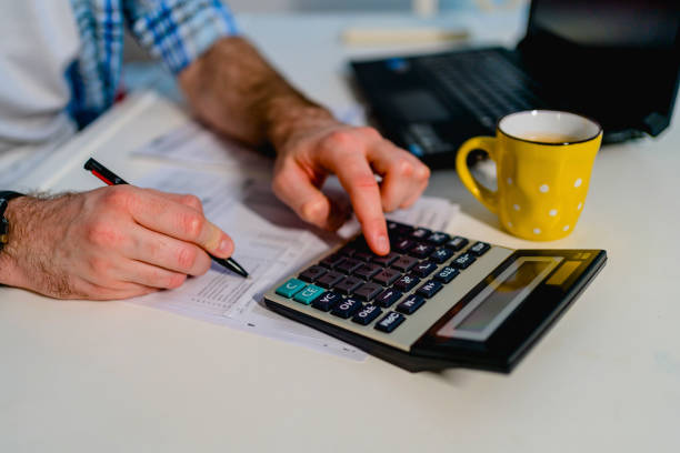 istock Man calculating family budget 1348086143