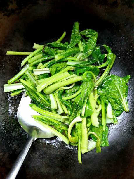 istock Stir Fried Bok Choy vegetable in cooking pan. 1348086190