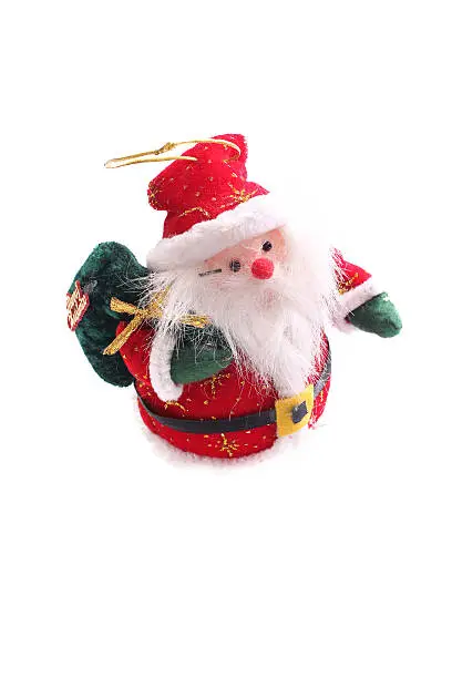 Santa Claus toy for the tree, with green gift bag on white background