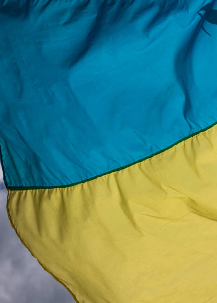 istock Ukraine flag waving on the wind against the blue sky 1348089493