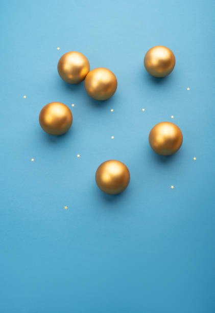 istock Christmas balls on a blue background with stars 1348089780