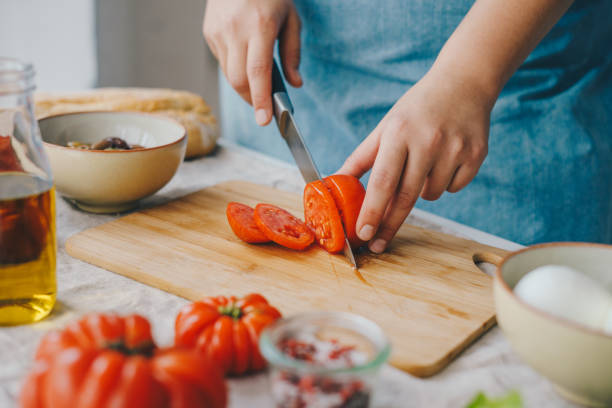 istock Woman cooking Caprese salad 1348090618