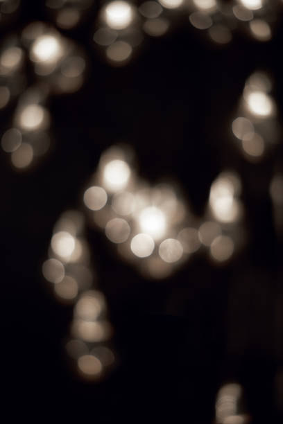 istock White bokeh lights in the dark 1348091062