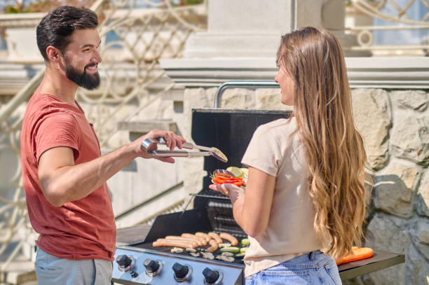 istock A young couiple cooking grilled veggies together and looking happy 1348092182
