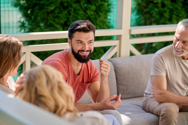 istock Family resting together after thanksgiving dinner and talking 1348092246