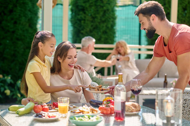 istock Family spending time together and having dinner 1348092281