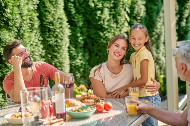 istock Cute family spending time in the back yard and looking happy 1348092306