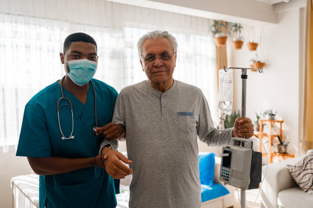 istock Health visitor and a  man during home visit 1348093616