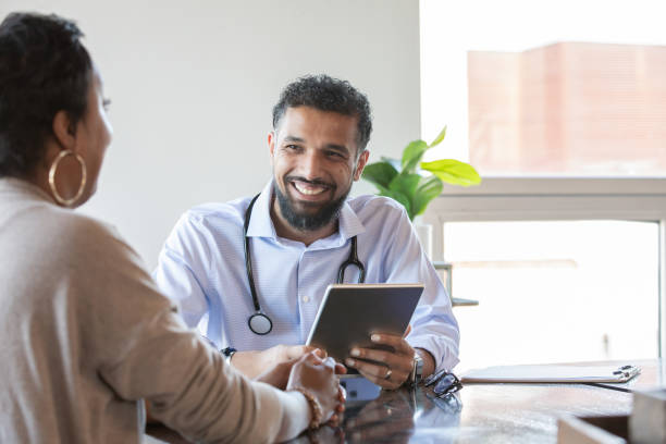 doctor and patient at appointment - clinic men healthcare and medicine doctor imagens e fotografias de stock