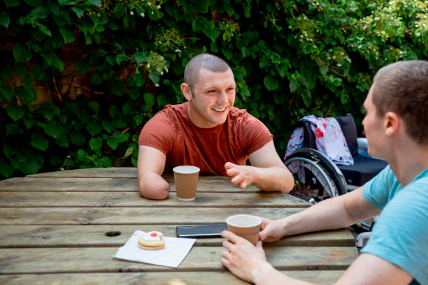 istock Friends Having a Coffee in the Park 1348095993