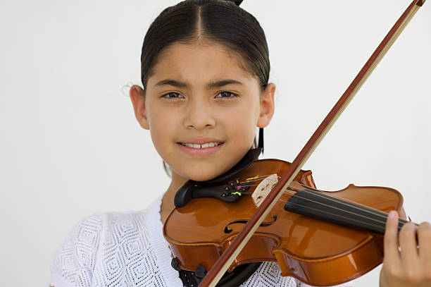 istock Little girl with violin 134809625
