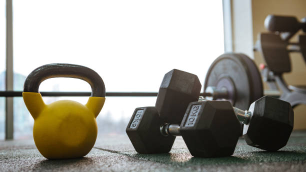 istock Photo of dumbbells on floor. 1348097465