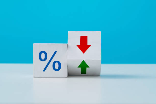 Percentage sign with up or down arrow stock photo
