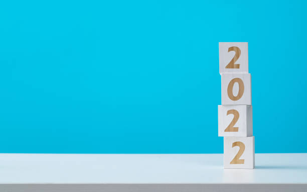 istock Wooden block with number 2022 on the table 1348098882