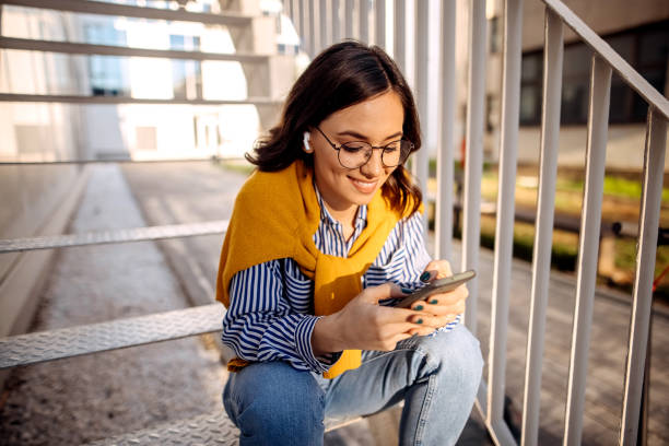 istock Young businesswoman texting 1348099443