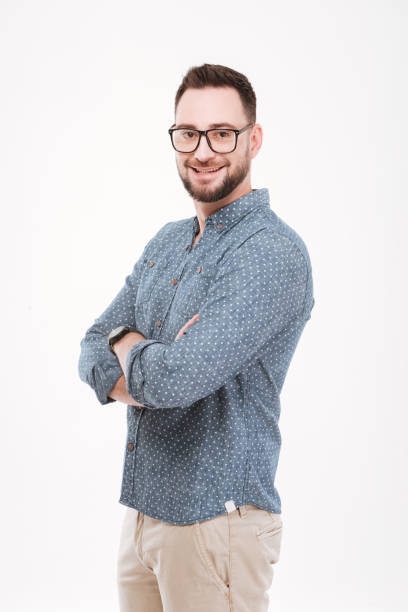 istock Smiling young bearded man posing isolated over white background. 1348100326