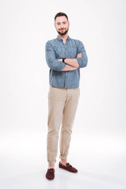 istock Handsome young bearded man with arms crossed 1348100831