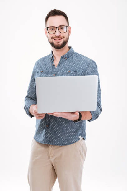 istock Attractive young bearded man using laptop 1348101517