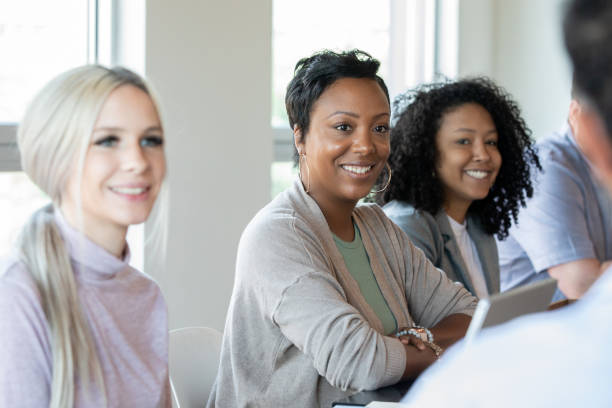 istock Diverse group of professional adults attending training class or board meeting 1348104178