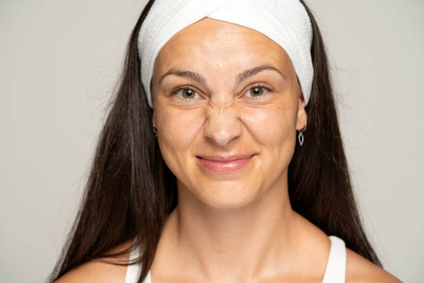 young woman frown the wrinkles around her nose stock photo