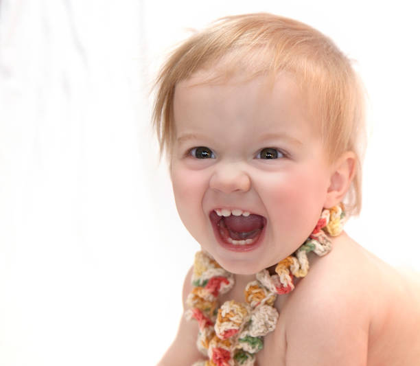 feliz bebé gran sonrisa - studio shot mouth open horizontal head and shoulders fotografías e imágenes de stock