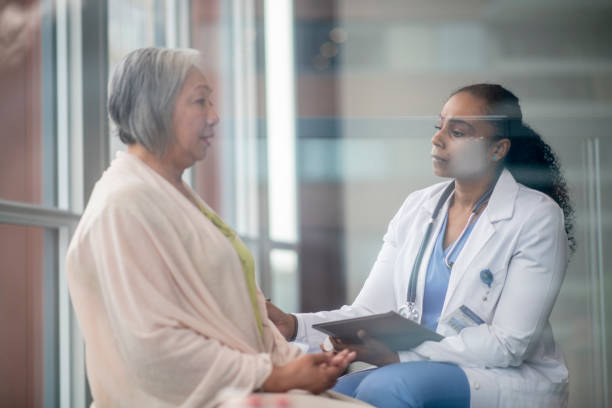 istock Doctor Comforting a Senior Patient 1348111932