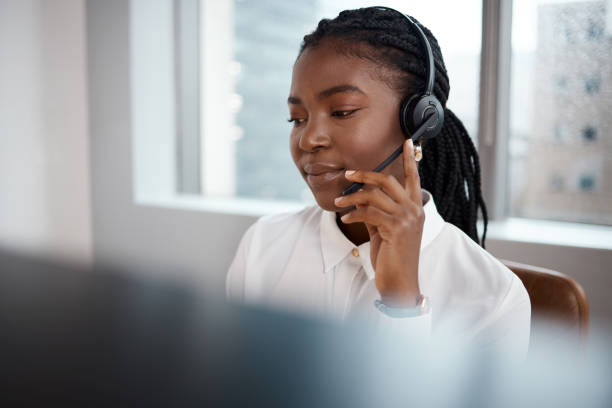 istock Shot of a call center agent working at her desk 1348113221