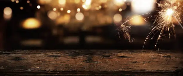 Photo of Counter with golden bokeh and sparkler