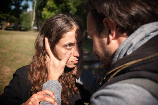 istock Jealous bully abuser abuses his girl girlfriend. Domestic violence concept 1348118128