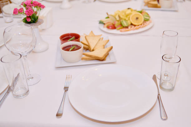 istock Table set with sparkling wineglasses, plates with serviette and cutlery on table, copy space. Place setting at wedding reception. Table served for wedding banquet in restaurant 1348118348