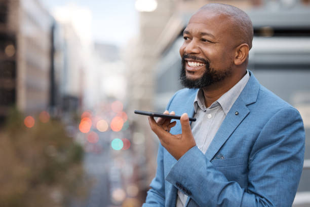 istock Shot of a mature businessman using a cellphone while standing on a balcony outside an office 1348123407