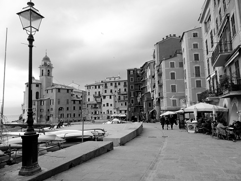 Liguria, Italy - October 10, 2021: Beautiful photography in black and white to the ligurian places  with panoramic view to the old buildings and clear sky in the background.