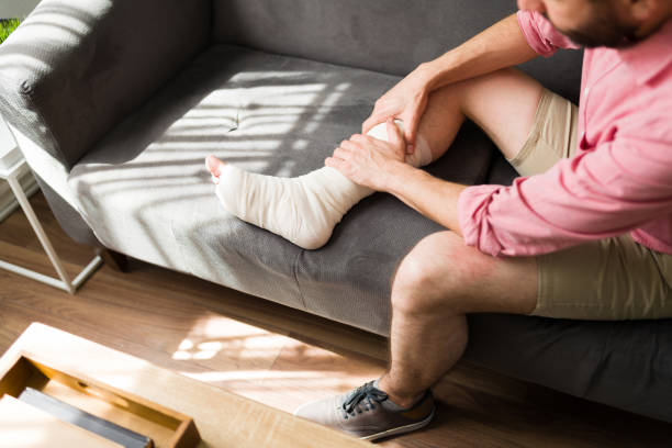 istock Injured man relaxing on the sofa 1348123821