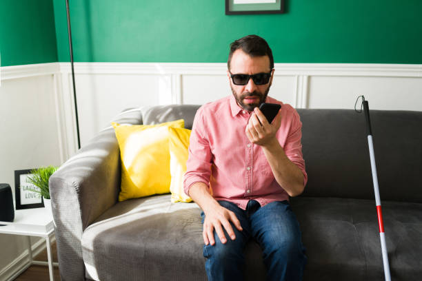 istock Disabled man making a call on his smart phone 1348124705