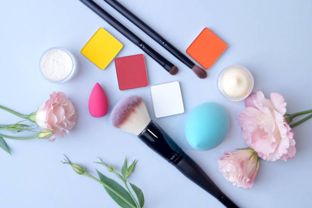 istock the makeup kit awaits its use surrounded by beautiful flowers 1348126684