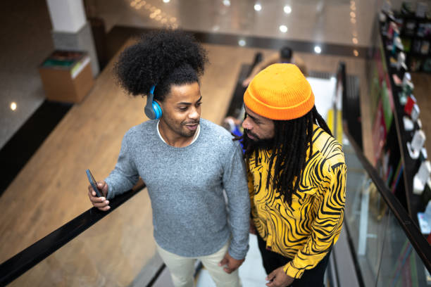 istock Brothers talking at the mall 1348127507