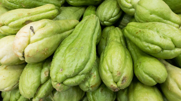 istock Chayote background. chayote on supermarket. Vegetable background. 1348128175