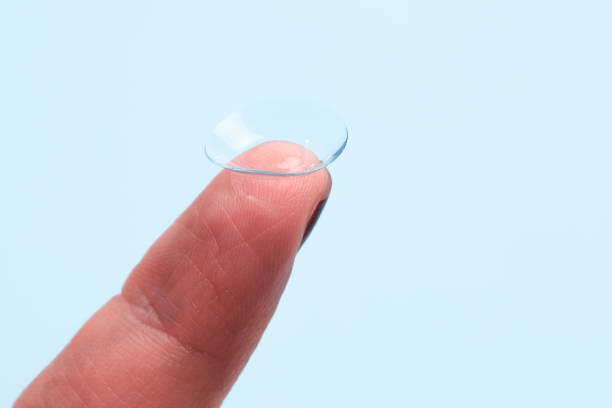 istock contact lenses on the finger on blue background 1348129118