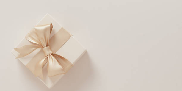 istock Give gift, holidays are coming concept. Christmas minimal composition. Beige gift box with golden ribbon bow top view, flat lay 3d rendering 1348130677