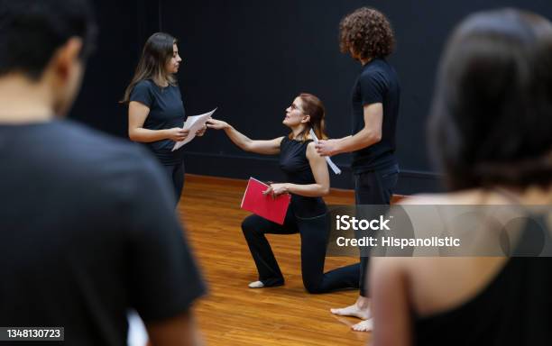 Acting Coach Directing An Improv Exercise With Her Students In A Drama Class Stock Photo - Download Image Now