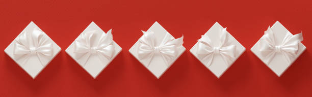 istock Christmas composition. New year festive concept. White gift boxes arranged in a row on a red 3d rendering background 1348130862