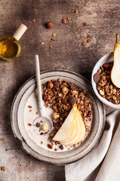 istock Chocolate granola with almond milk, pear and honey. 1348132025