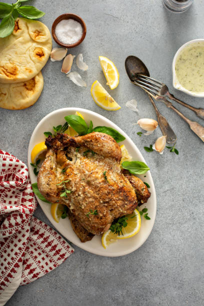 istock Whole lemon herbs and garlic roasted chicken 1348136419