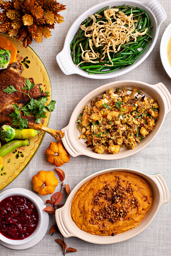 Traditional Thanksgiving sides, green beans casserole, stuffing and sweet potatoes