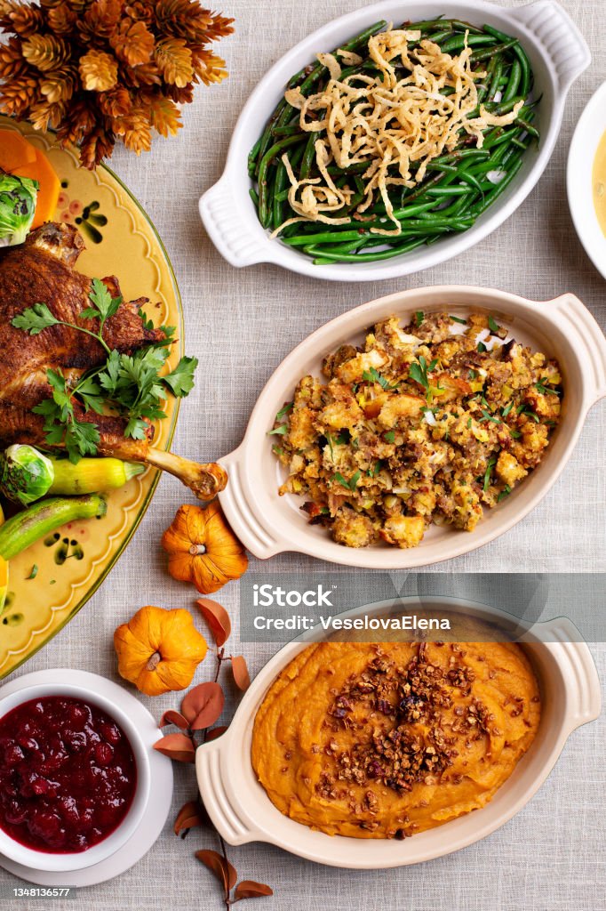 Traditional Thanksgiving sides Traditional Thanksgiving sides, green beans casserole, stuffing and sweet potatoes Thanksgiving - Holiday Stock Photo