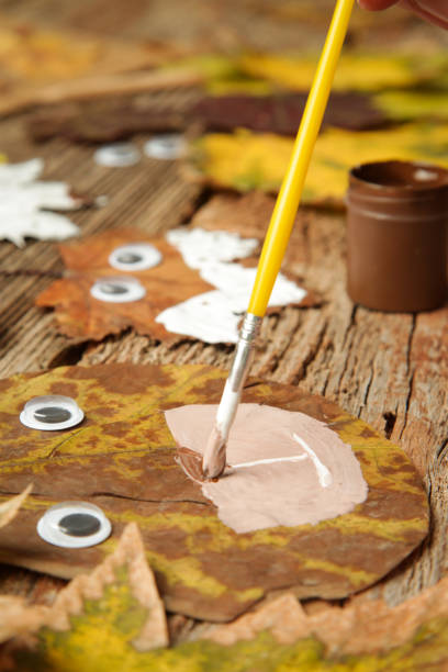 istock Crafts with autumn leaves. Maple leaf animals. 1348138272