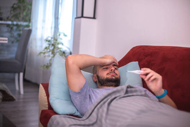istock Sick male with cold / flue / covid-19 1348139041