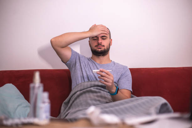 istock Sick male with cold / flue / covid-19 1348139066