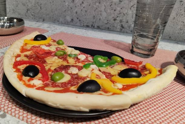 istock half a pizza cut into pieces ready to eat 1348139916