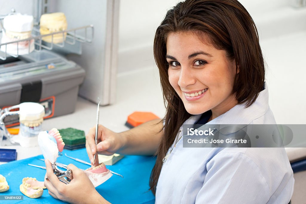 Dental profession Professional dental woman working with a denture Dental Equipment Stock Photo